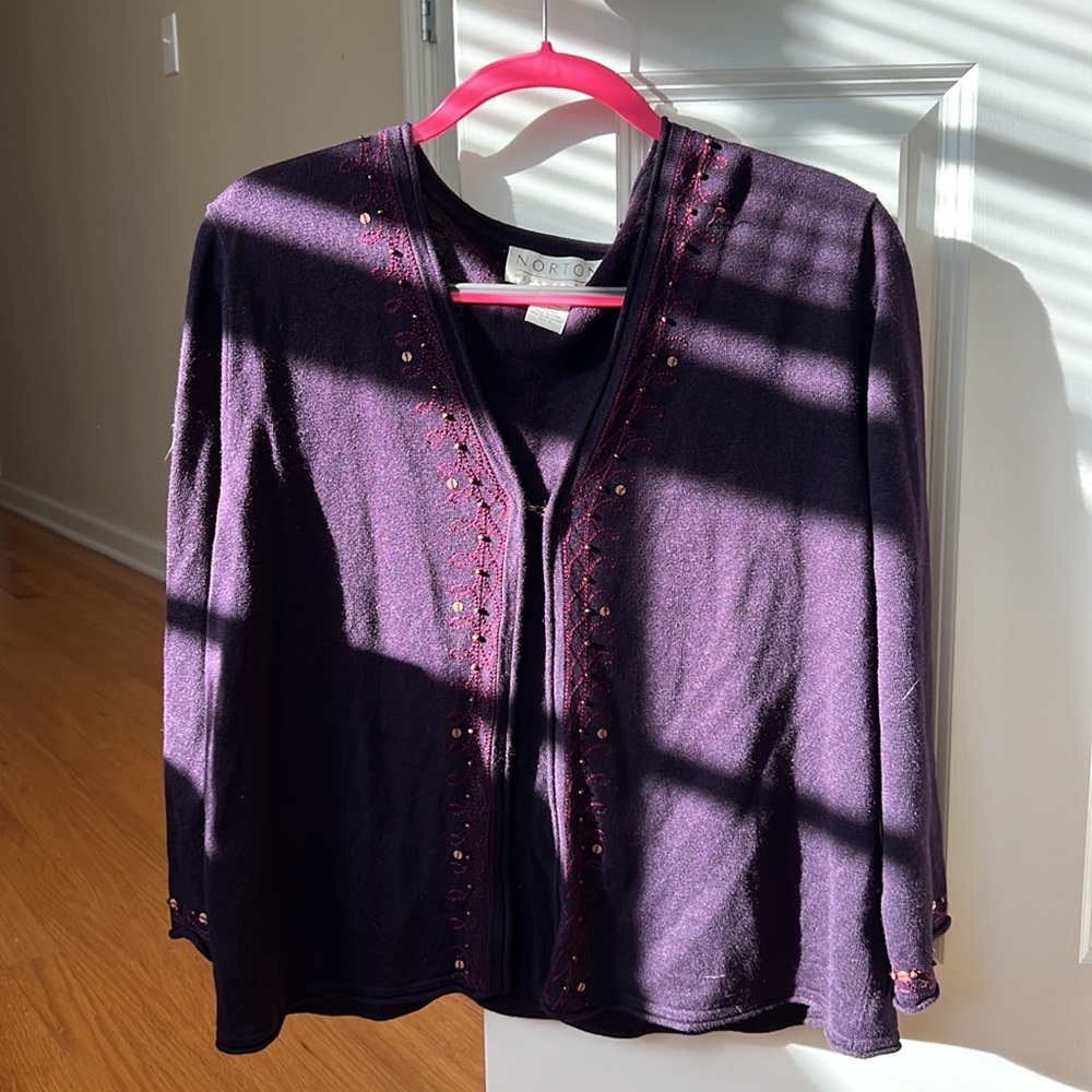 Soft purple cardigan sweater with delicate embroidered pattern